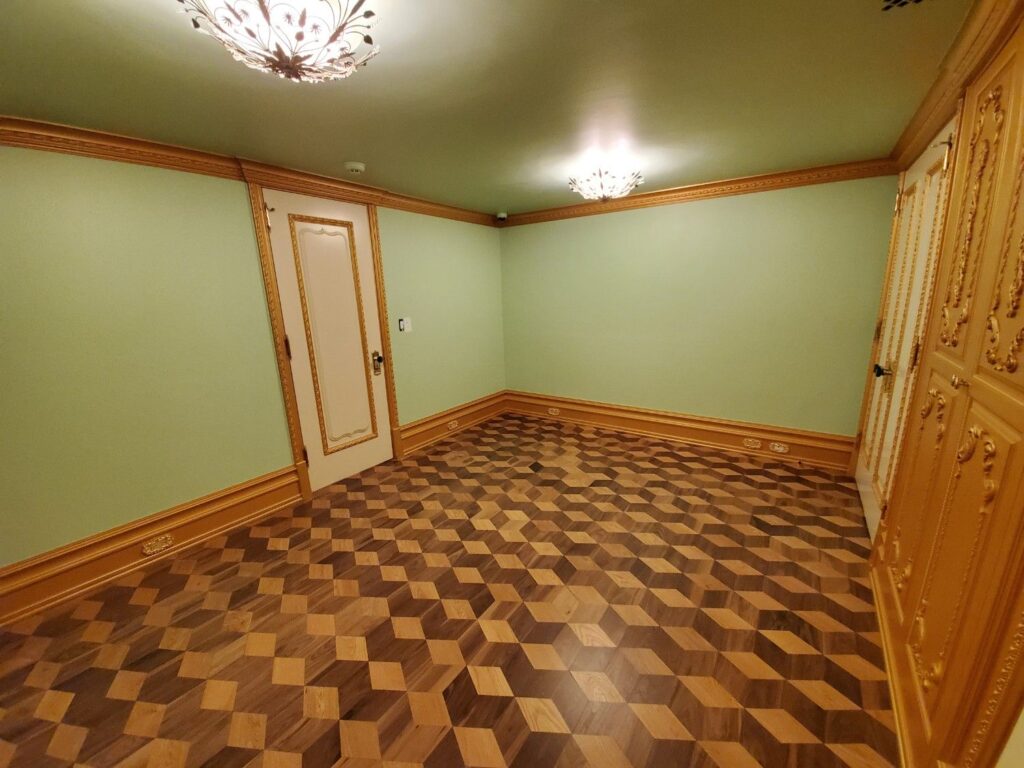 Family room area in basement by Andrea D'Alessio