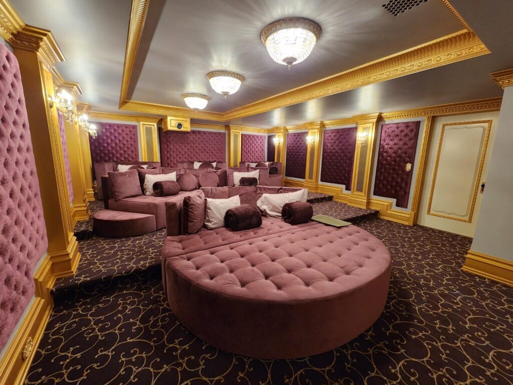 Custom wall finishes in theater room by Andrea D'Alessio